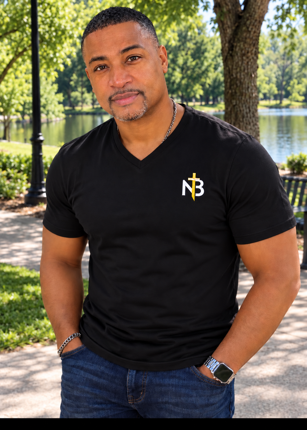 Pastor Marco McNeill outdoors wearing a New Breed Church shirt